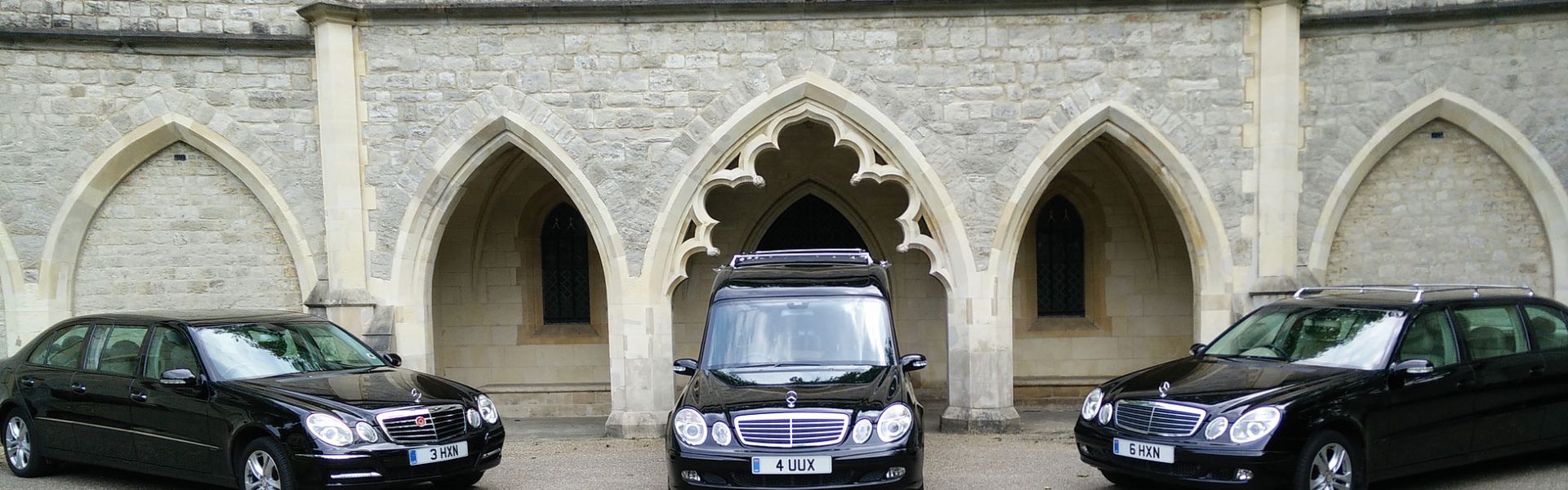 funeral vehicles parked