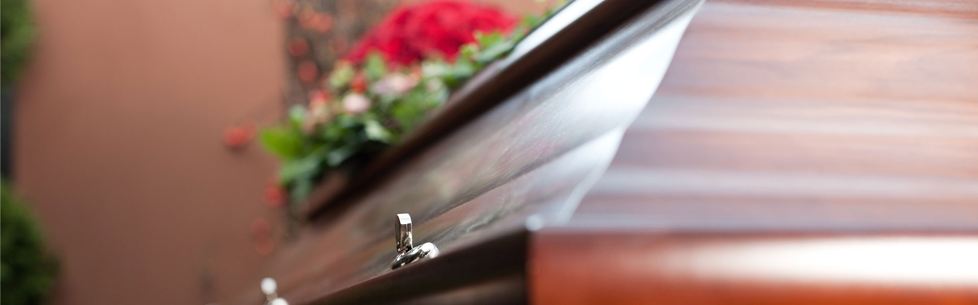 coffin with flowers on top